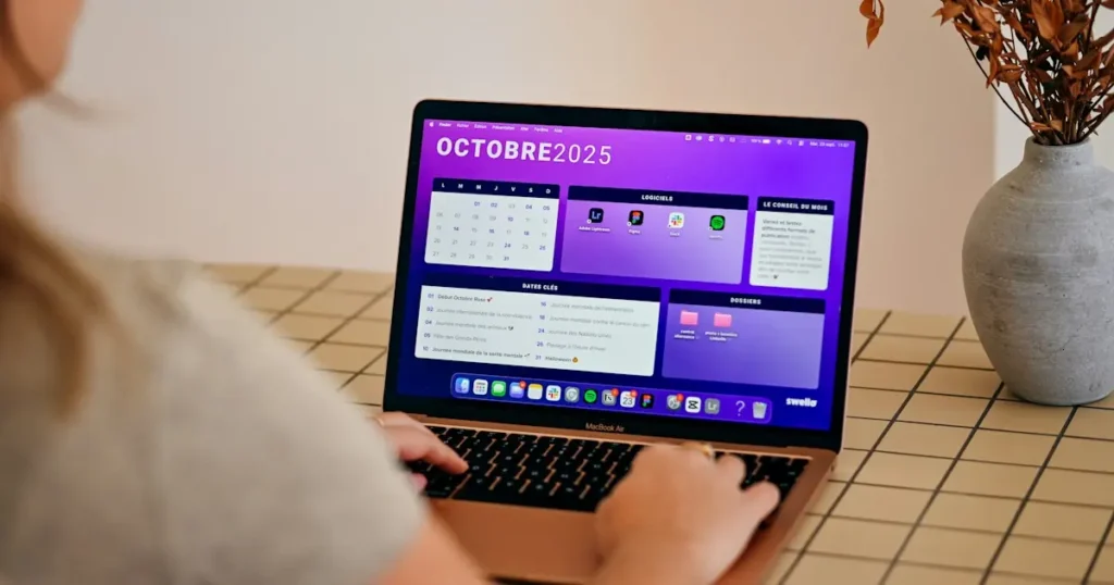 Business owner reviewing a monthly calendar on a laptop to plan billing dates while learning how to accept recurring payments