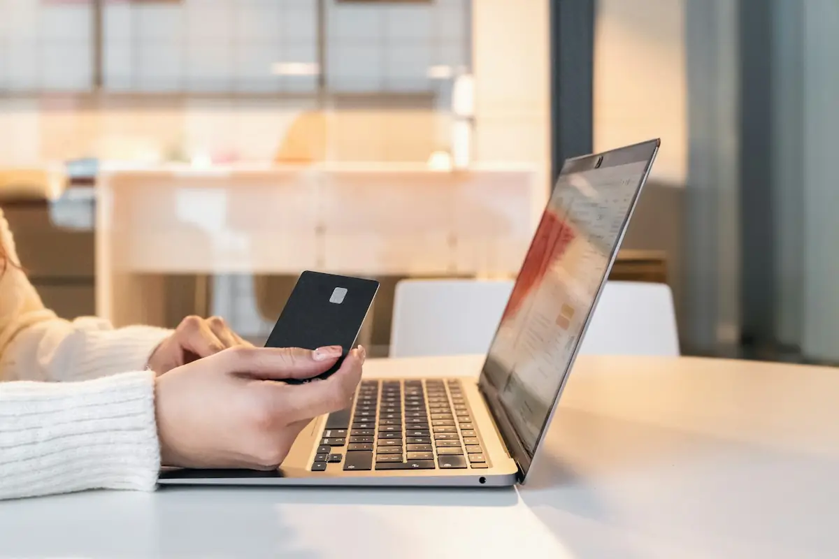 Customer entering card details at an online checkout on a laptop